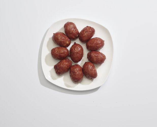A plate of Meatballs on a white background