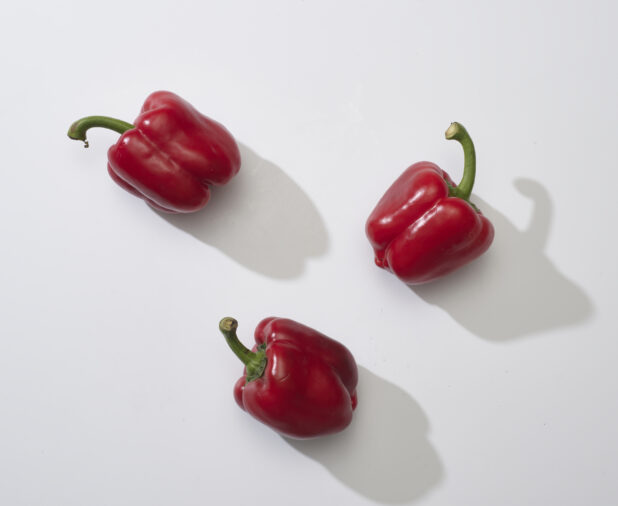 Sweet red bell peppers on a white background