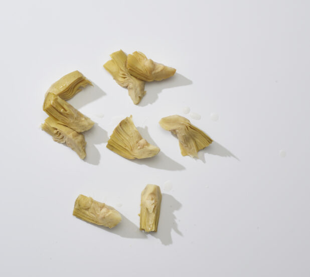 Cut artichoke hearts on a white background