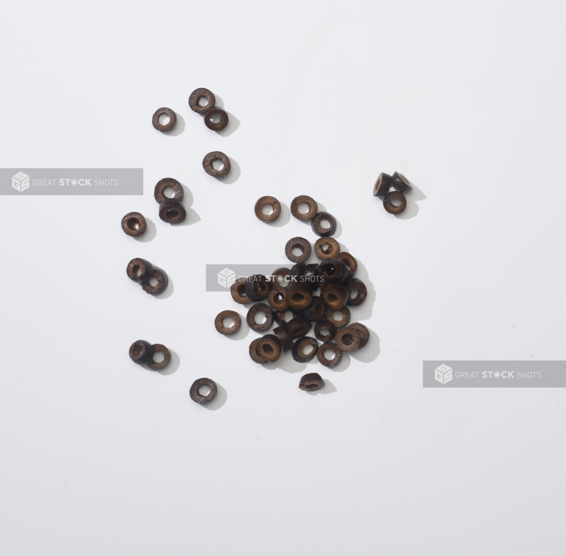 Sliced black olives on a white background