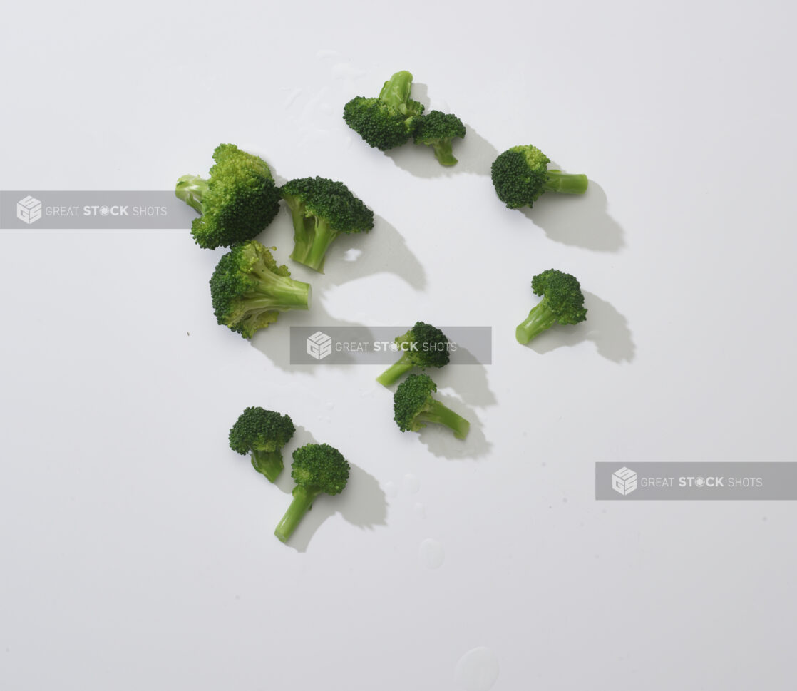 Broccoli florets on a white background