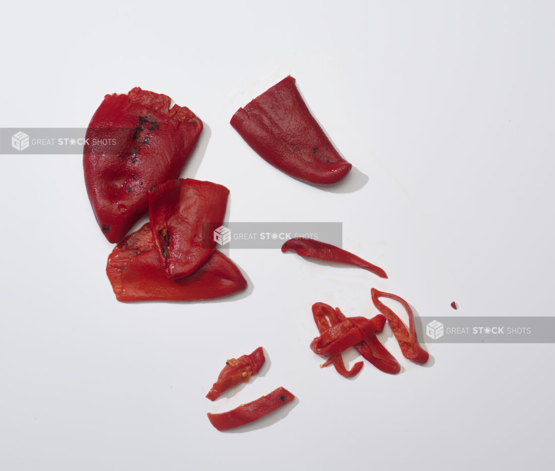 Roasted red peppers on a white background