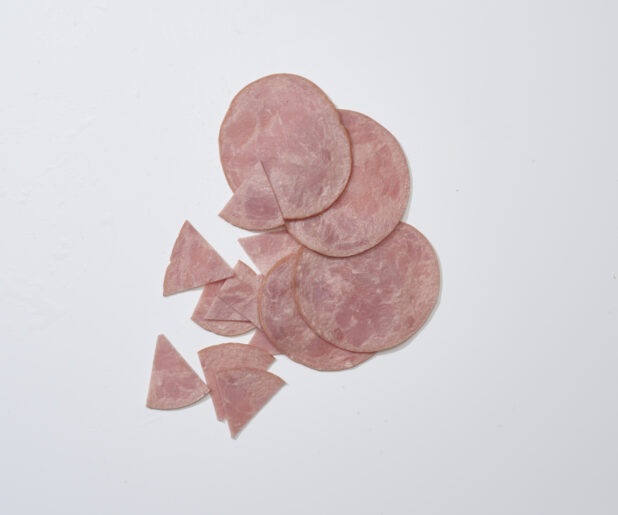 Sliced ham on a white background