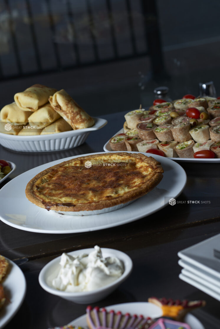 A buffet with assorted plates of Hanukkah food