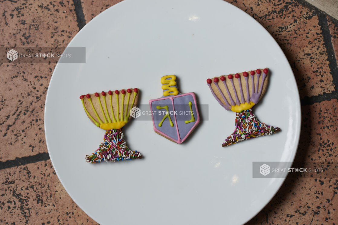 Decorated Hanukkah cookies on a white plate