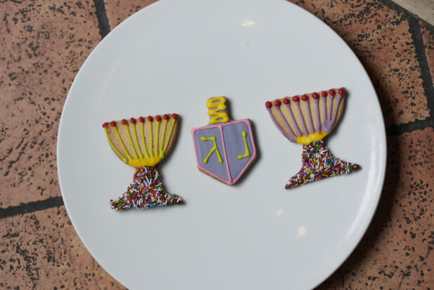 Decorated Hanukkah cookies on a white plate