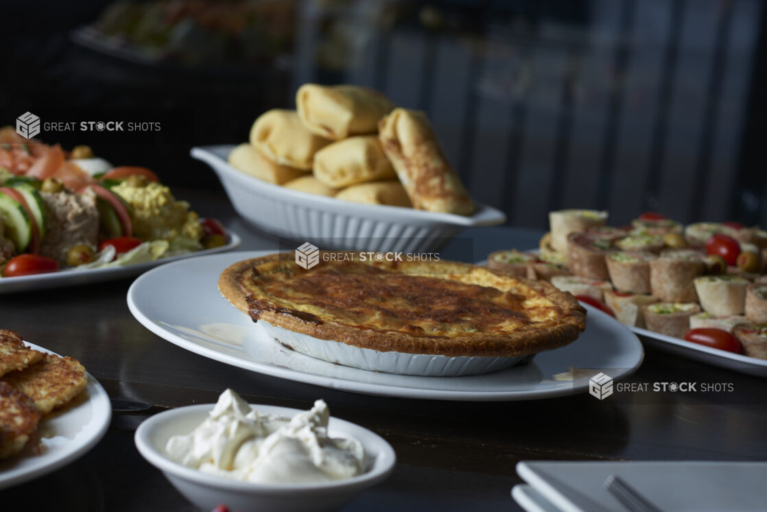 A buffet with assorted plates of food for Hanukkah