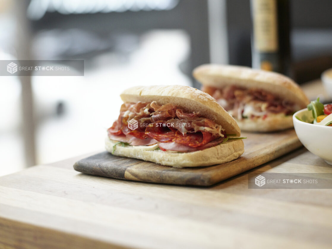 An Italian panini sandwich with prosciutto, Genoa salami, and ham