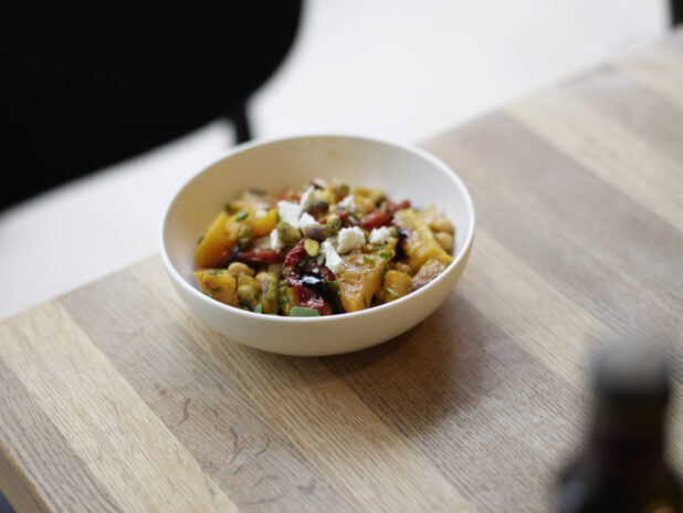 A Mediterranean roasted vegetable salad with feta and pistachio