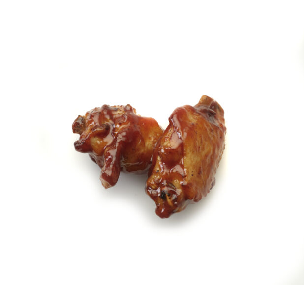 Barbecue sauced wings on a white background