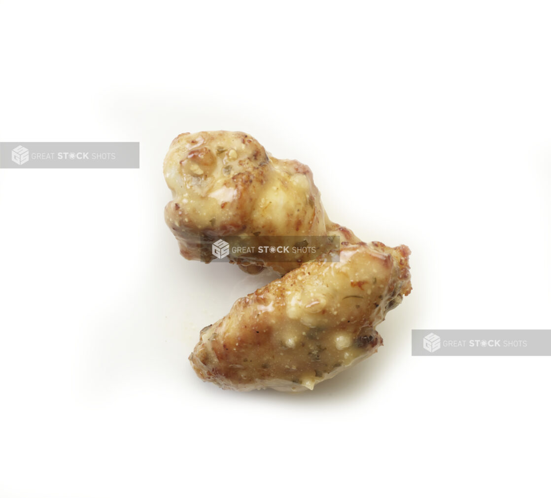 Garlic parmesan sauced wings on a white background