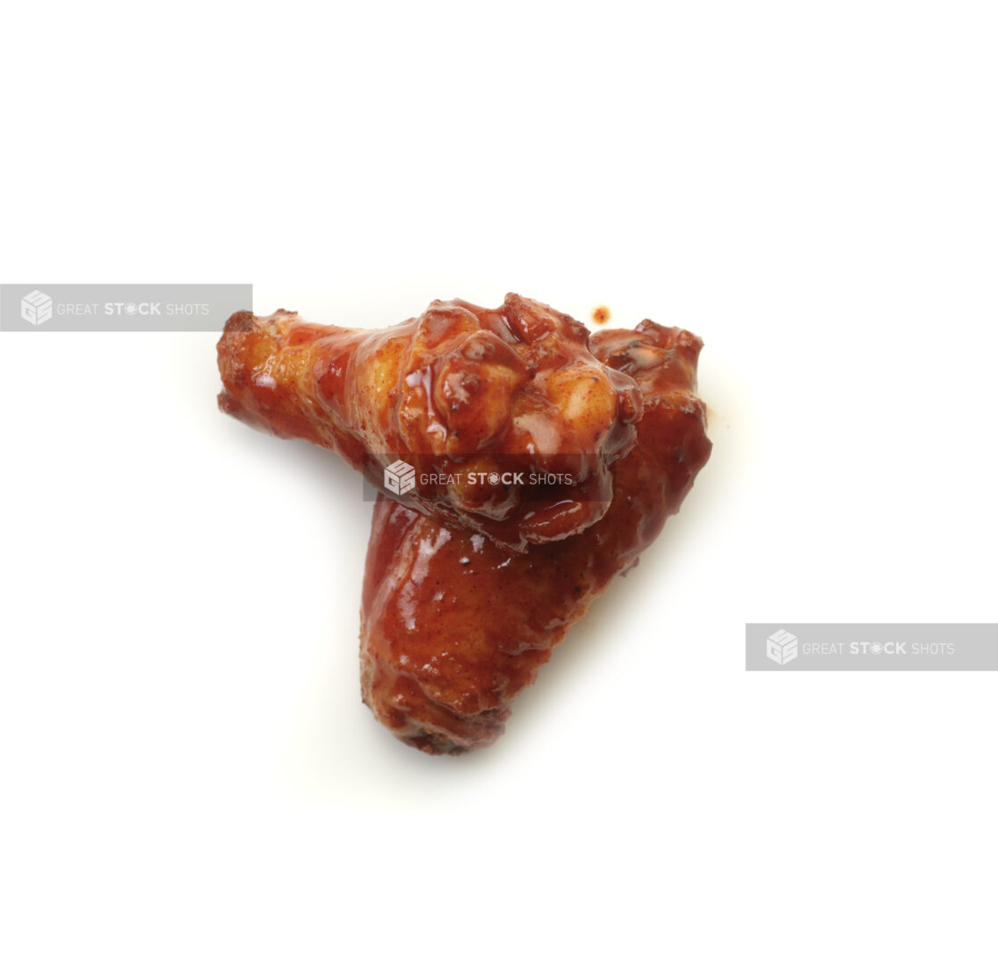 Tandoori sauced wings on a white background