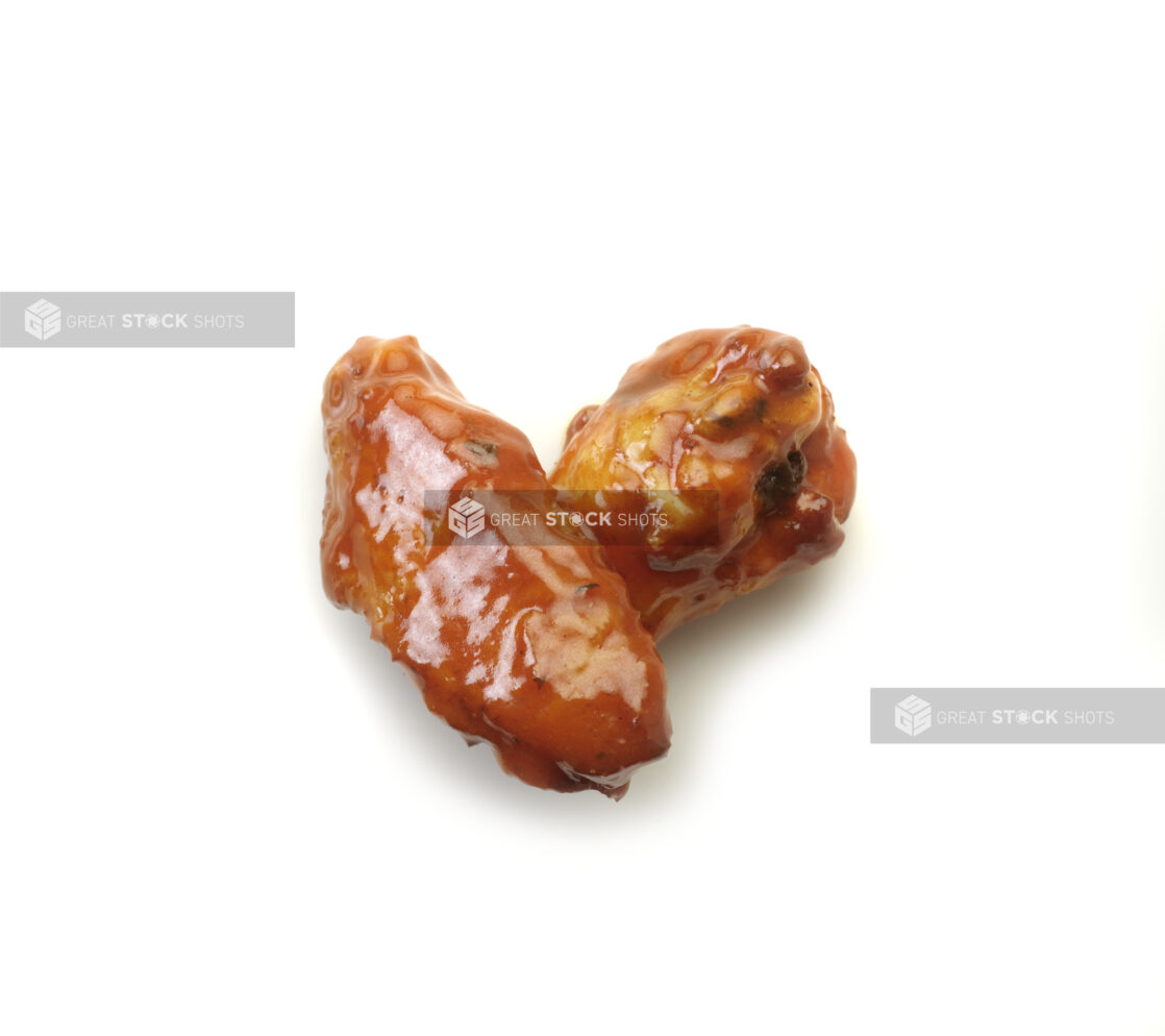 Tikka Masala sauced wings on a white background