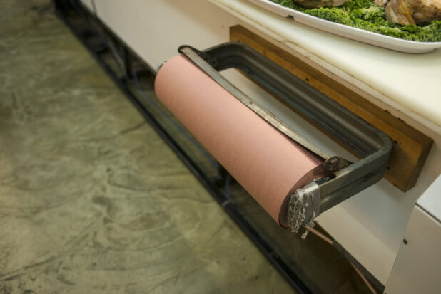 Roll of butcher paper behind the counter in a butchery