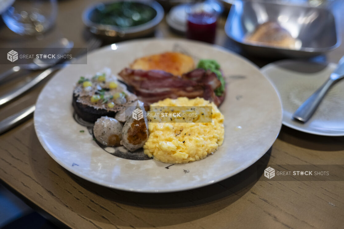 A Full English Breakfast on a Large Ceramic Plate in a Restaurant Setting in London, England