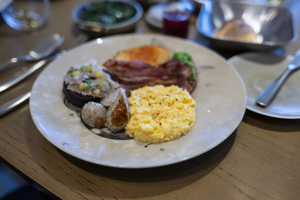 A Full English Breakfast on a Large Ceramic Plate in a Restaurant Setting in London, England