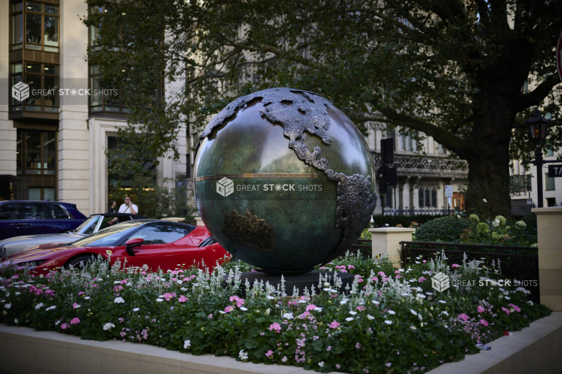 Map of the world on a metal globe in a park in London, England