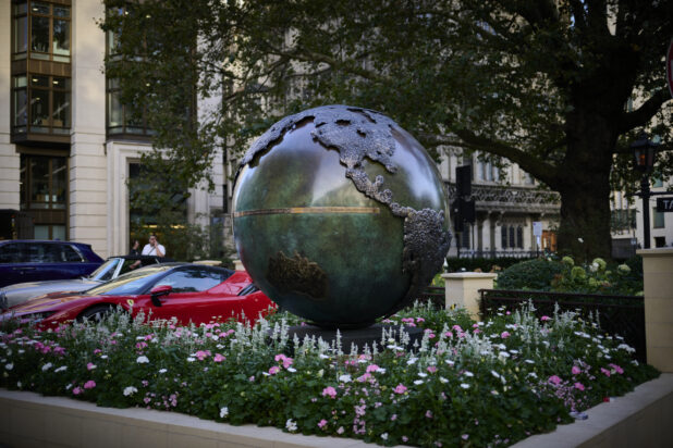 Map of the world on a metal globe in a park in London, England