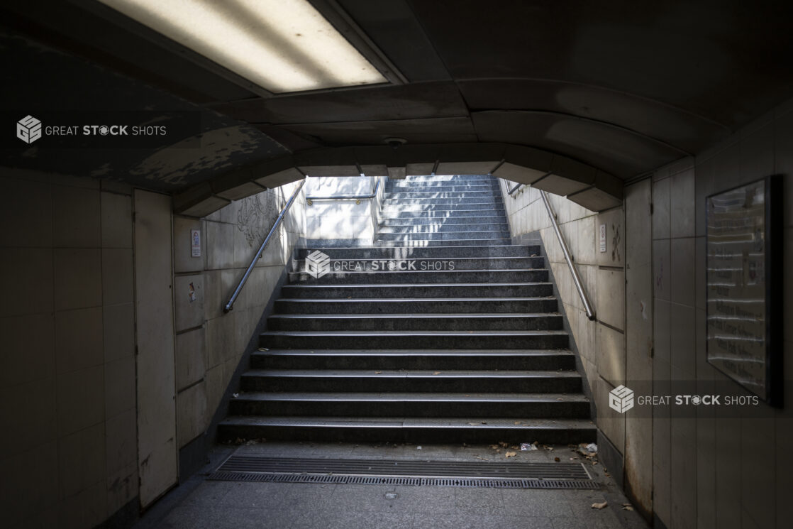 Medium shot of Archway and Stairway out of Underground Passage