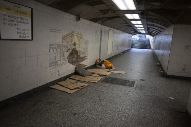 London Underground Subway Tunnel, long shot of empty tunnel, abandoned cardboard