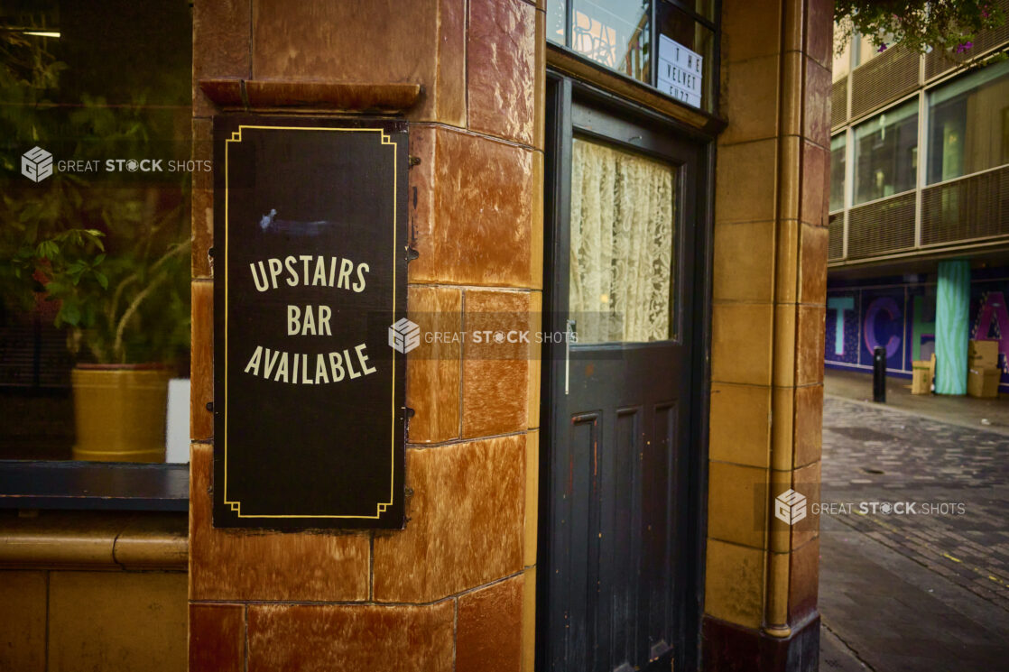 Entrance to an old style English pub on a street corner, London, England