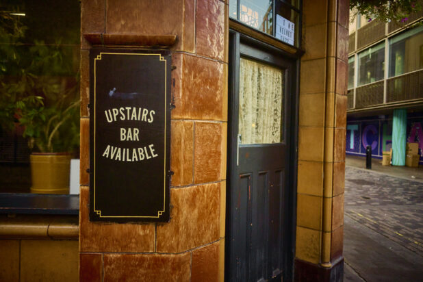 Entrance to an old style English pub on a street corner, London, England