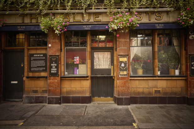 London, England pub exterior, street view, hanging plants, "A Proper old London boozer"