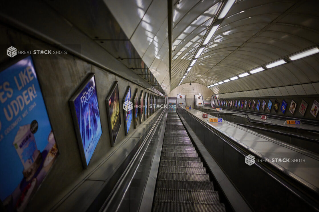 London subway "Tube" station escalator, looking down towards the tracks, England