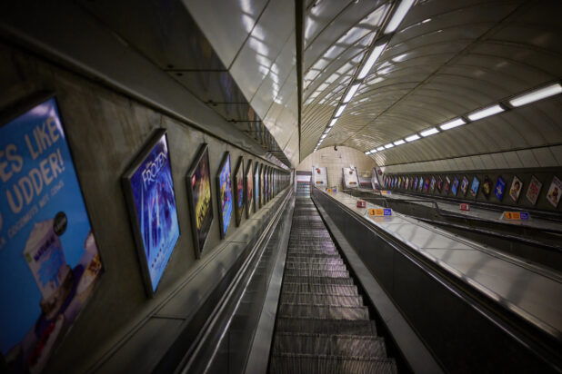 London subway "Tube" station escalator, looking down towards the tracks, England