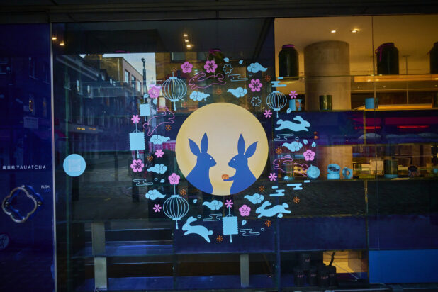 Window view of a restaurant with a Mid Autumn Festival motif on the window in London, England