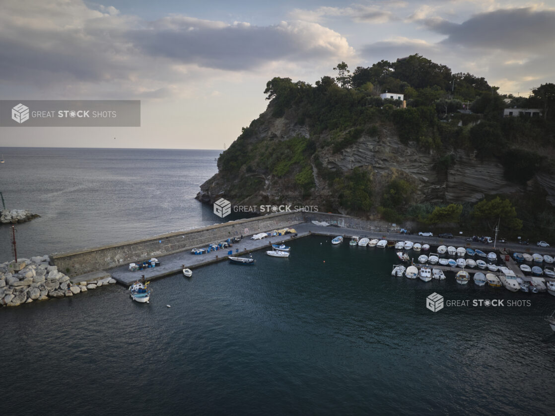 View of a marina in Italy with a hillside in the background