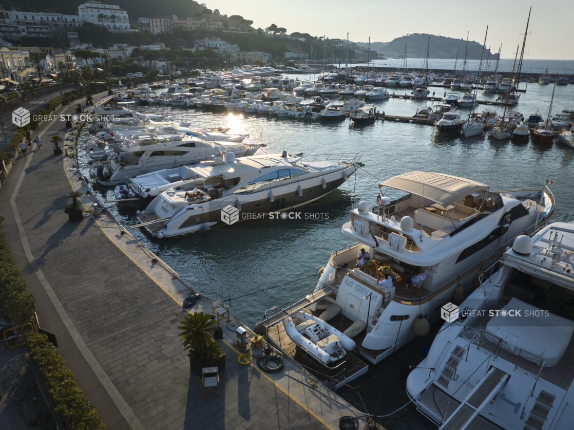 Sunrise/Sunset view of a marina, roadway a and town in Italy, close up view