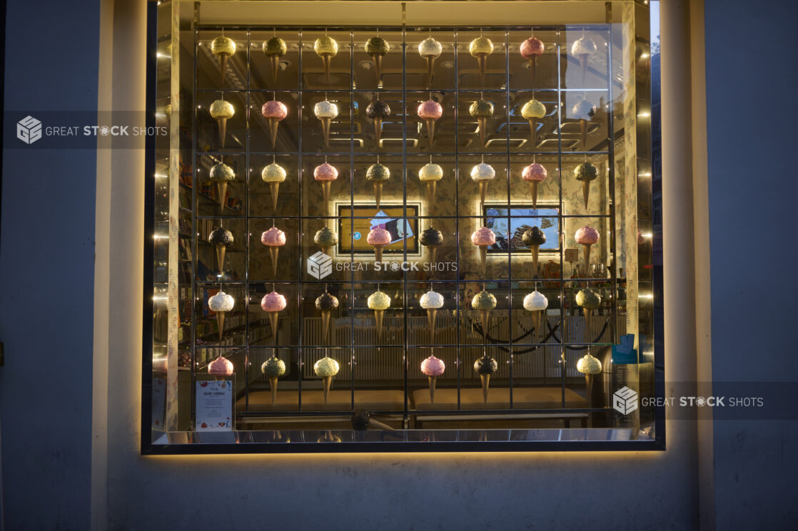 A colourful display of ice cream/gelato cones in a storefront window in London, England