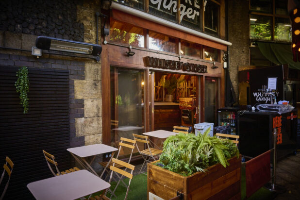 Whiskey Ginger pub in London England - establishing shot of building and patio