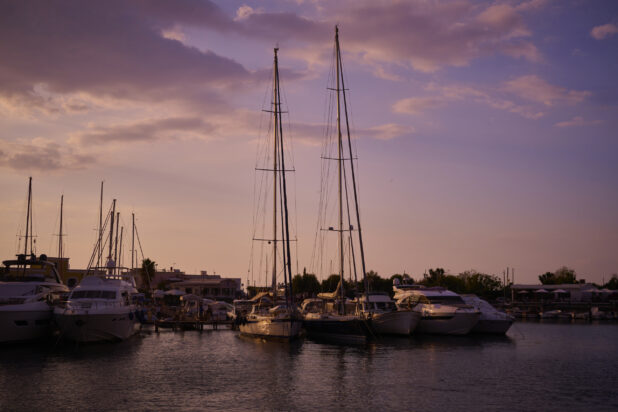 Yachts, Boats and Sailboats Docked in Marina at Sunset