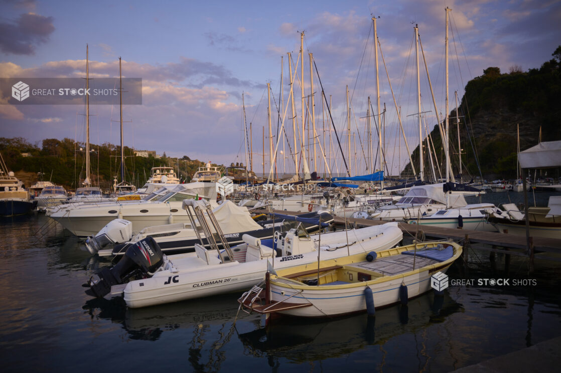 Yachts, Boats and Sailboats Docked in Marina at Sunset