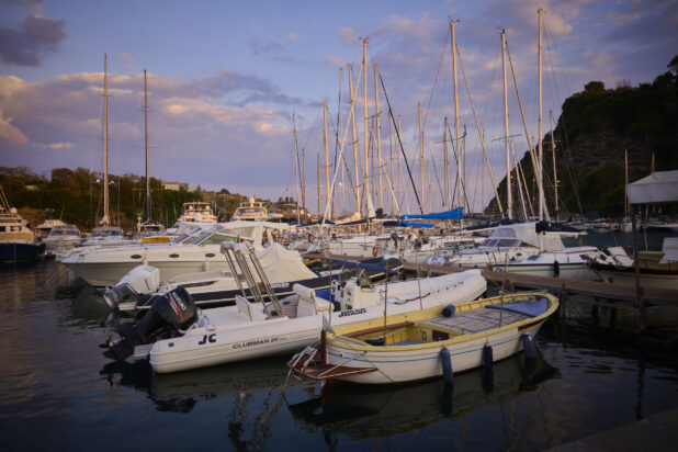 Yachts, Boats and Sailboats Docked in Marina at Sunset