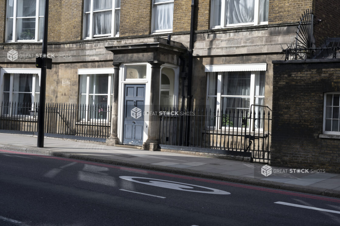 Medium shot of English Row House with slate door from the street