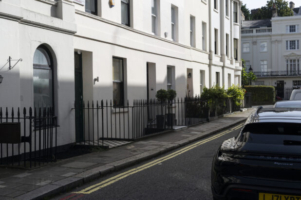 Medium Shot of White Building on Quaint European Street