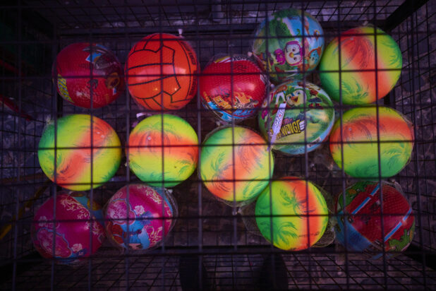 Colourful Children's Bouncy Balls in a Cage