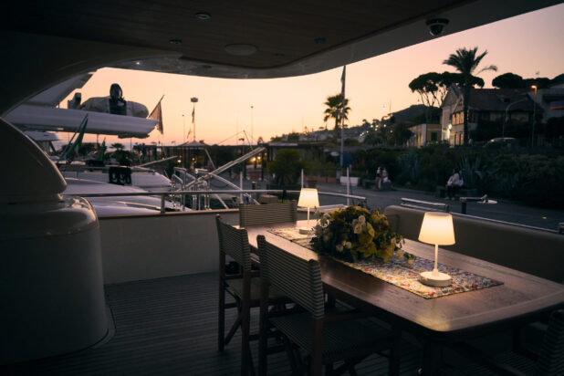 Dinner Table View from a Yacht or Boat Moored at a Slip at Sunset