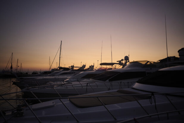Med shot of multiple Yachts at Sunset