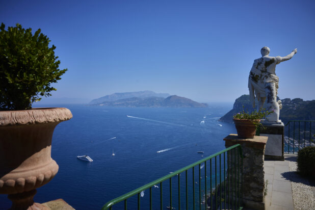 Outdoor Terrace with statue of Caesar Augustus overlooking Italian Coast in Capri