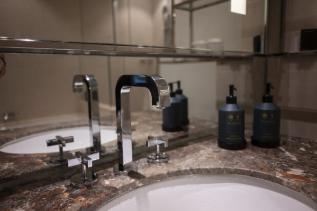 Bathroom sink and counter with hand soap dispensers
