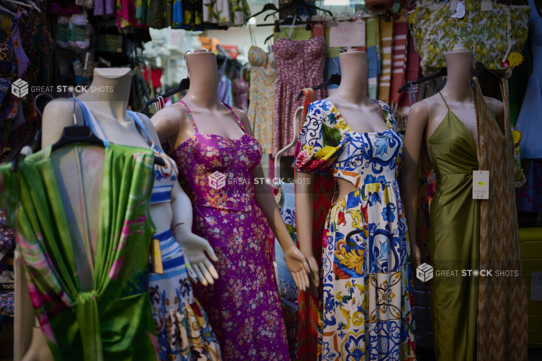 Mannequins with colourful dresses on in a clothing store on the Amalfi coast, Italy