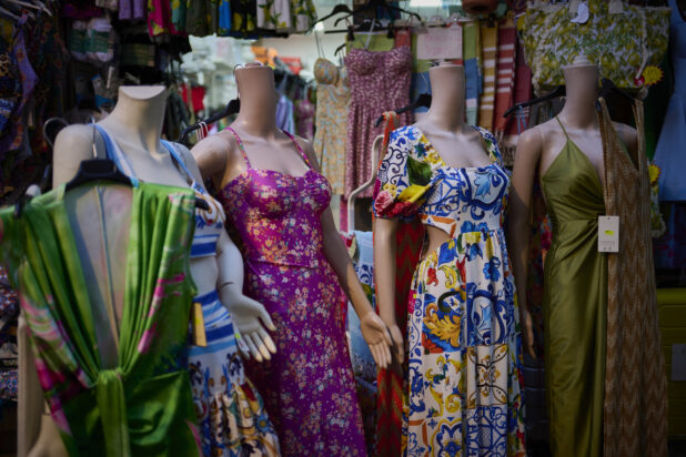 Mannequins with colourful dresses on in a clothing store on the Amalfi coast, Italy