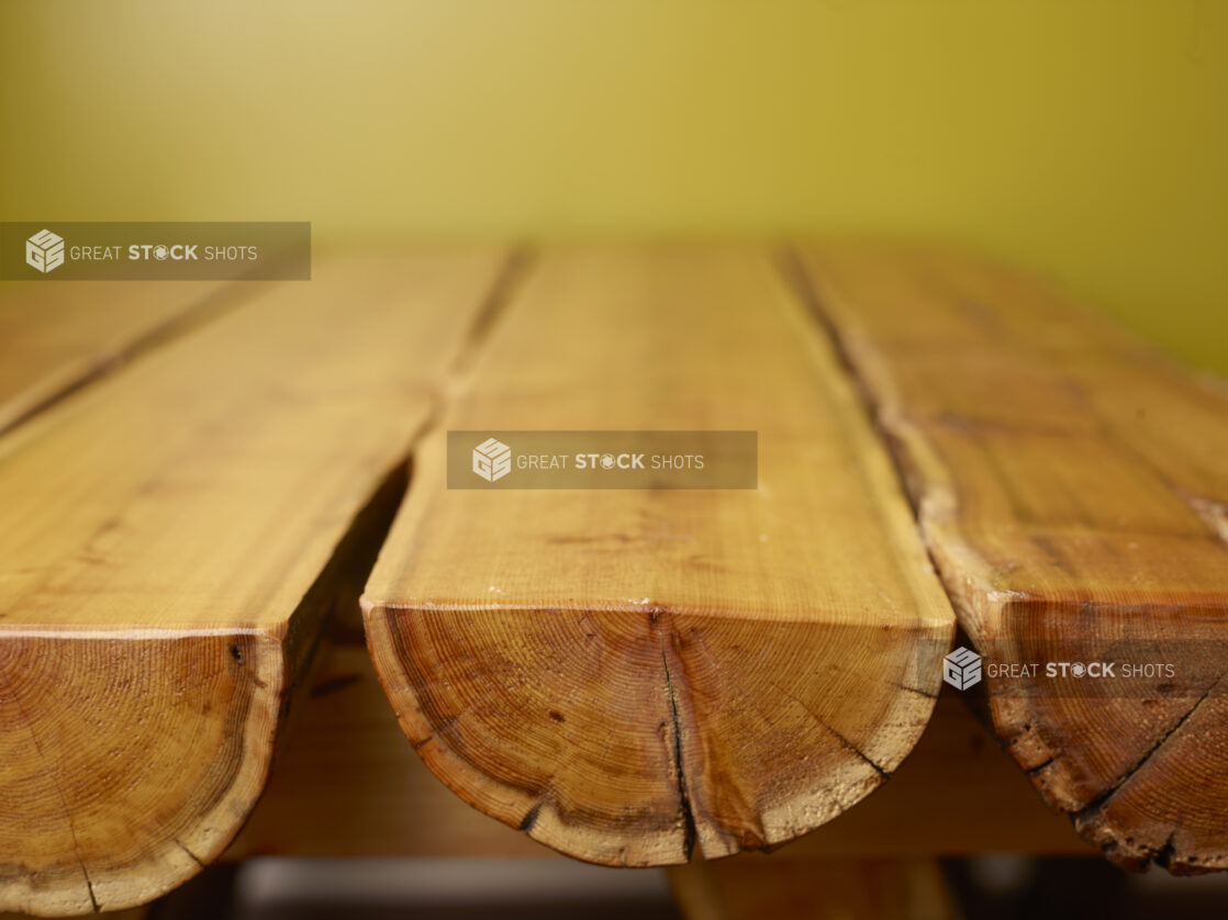 Wood Panelled Table Against Green Background with Bokeh Effect