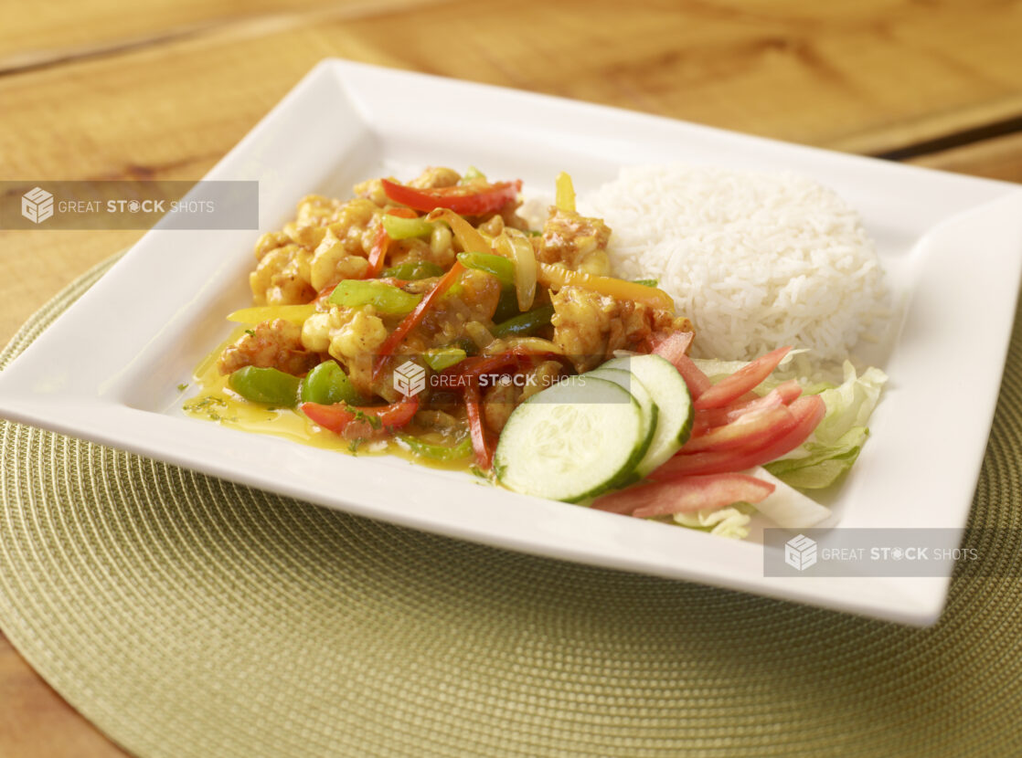 Breaded Shrimp Curry on Square White Dish with White Rice and Fresh Salad