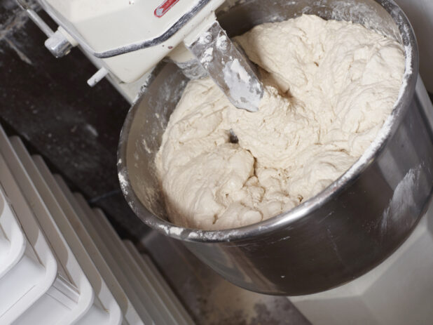 pizza dough in a professional restaurant kitchen mixer