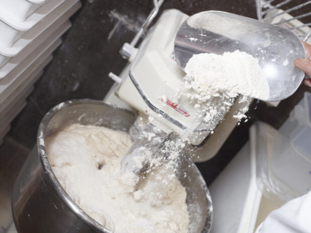 Pizza Dough Mixer Machine with Flour in Kitchen Setting